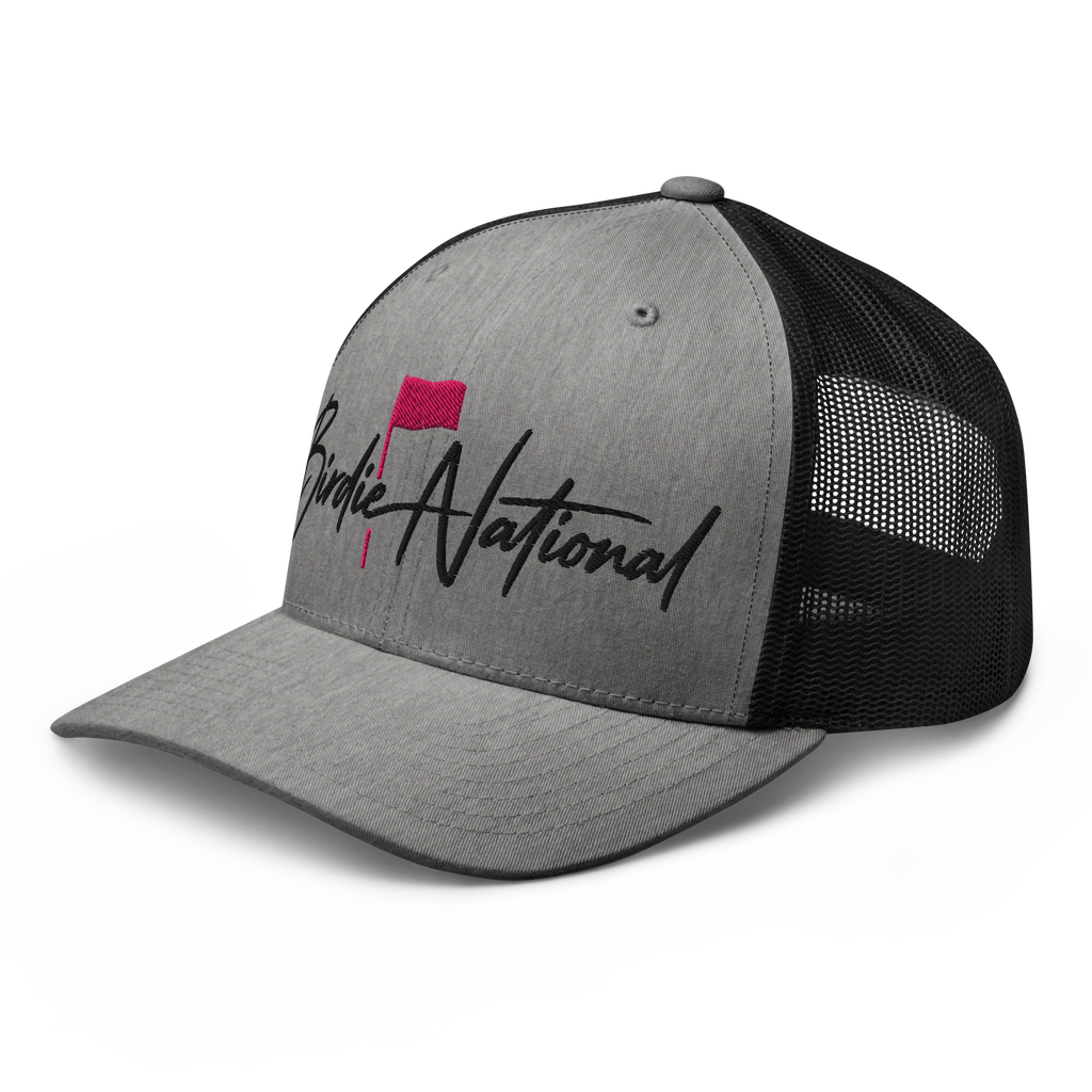 Birdie National grey and black mesh back trucker hat with pink flag embroidery on the structured front panel.