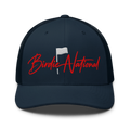 Birdie National navy blue trucker hat with breathable mesh back and red embroidered logo on the front panel.